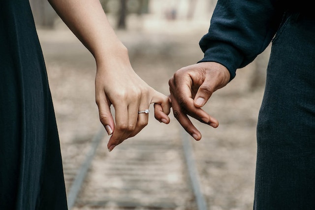 couple holding hands couple holding hands